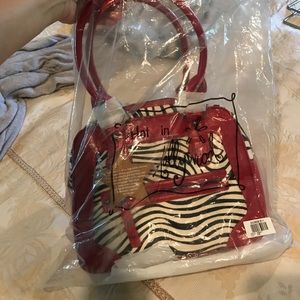 Zebra fur print with leather trim.